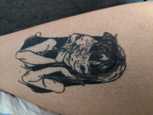 Explore cute dinosaur tattoo ideas, creative tattoo ideas in Buffalo, available at True Gloom Tattoo Studio