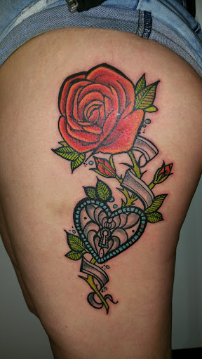 Explore butterfly spine tattoo ideas, creative tattoo ideas in Hilliard, available at 22 Caliber Tattoo Mega Studio