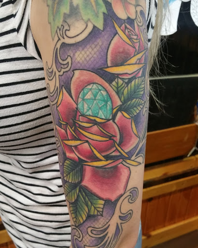 Explore feminine back tattoo ideas, creative tattoo ideas in Fort Smith, available at Hanging City Body Modification