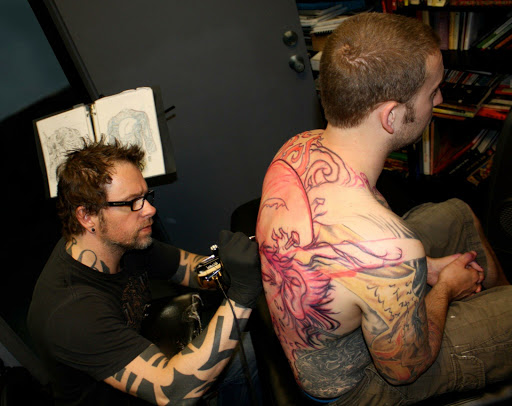 Explore man leg tattoo ideas, creative tattoo ideas in Addison, available at Cat Tattoo