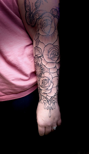 Explore forearm tattoo filler ideas, creative tattoo ideas in Osage Beach, available at Lake Ozark Tattoo and Hair Studio