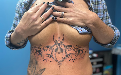 Explore laugh now cry later tattoo ideas, creative tattoo ideas in Foley, available at Symbolic Ink Tattoo Studio