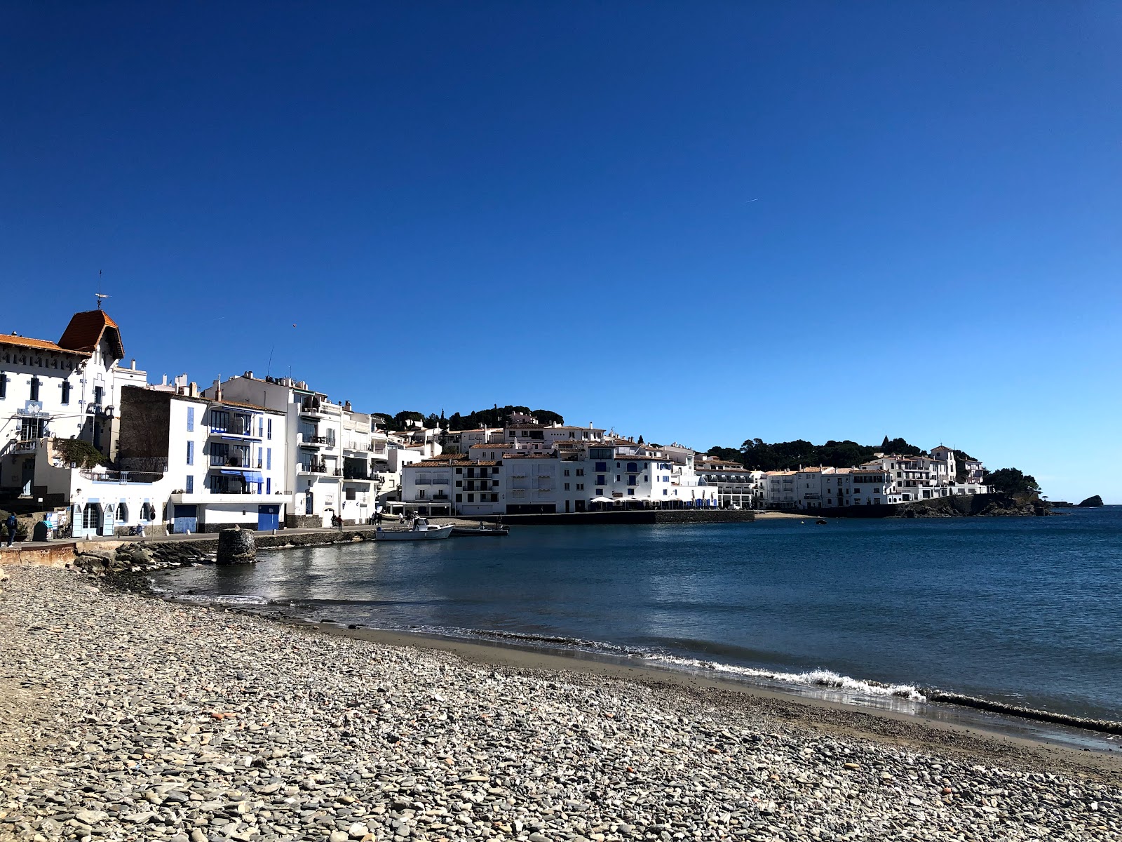 Photo de Platja Port d'Alguer avec l'eau bleu-vert de surface