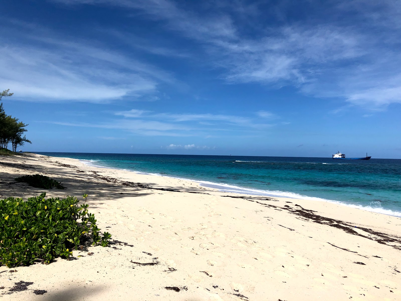 Fotografija Colonial beach z svetel pesek površino