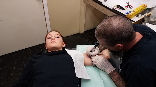 Explore dogwood tree tattoo ideas, creative tattoo ideas in Hays, available at Fantasy Graphics Tattoo Studios