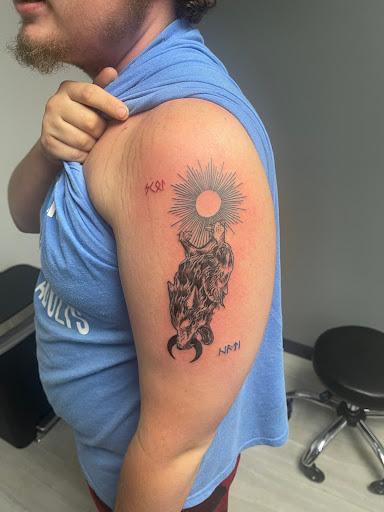 Explore tombstone movie tattoo ideas, creative tattoo ideas in Falls City, available at Studio 1816 Tattoos