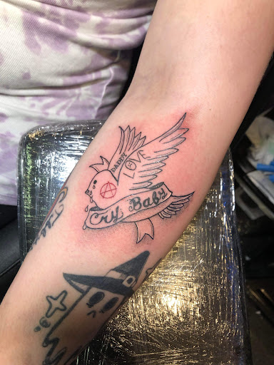 Explore tattoo flag ideas, creative tattoo ideas in Kokomo, available at Happys Tattoo Studio