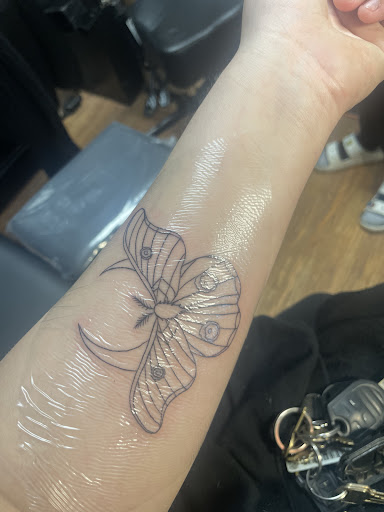 Explore beautiful flower tattoo ideas, creative tattoo ideas in Fenton, available at The Rusty Hatchet Tattoo Parlor