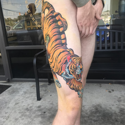 Explore snowboard tattoo ideas, creative tattoo ideas in North Charleston, available at Blu Gorilla Tattoo