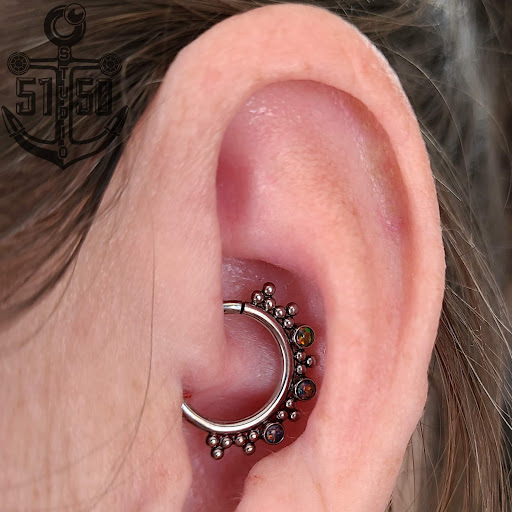 Explore female arm sleeve tattoo ideas, creative tattoo ideas in Kearney, available at Studio 5150 Piercing & Fine Jewelry