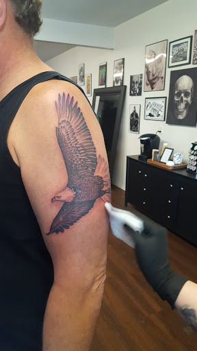 Explore last name tattoo ideas on arm, creative tattoo ideas in Roscoe, available at Elevated Ink Tattoo