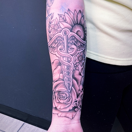 Explore ring tattoo cover up ideas, creative tattoo ideas in Cadillac, available at Limitless Ink Tattoo Studio