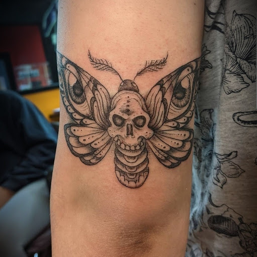 Explore grumpy bear tattoo ideas, creative tattoo ideas in Ambler, available at Tattoo GalaxyAmbler Piercing & Custom Tattoos