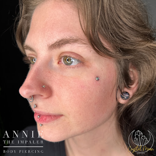 Explore wedding ring tattoo ideas for men, creative tattoo ideas in Bloomington, available at Crystal Moon Body Arts