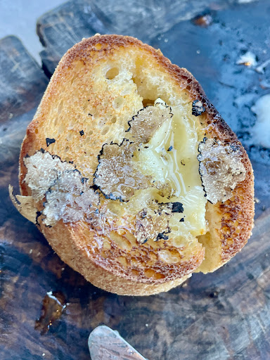 French baguette with brie cheese and truffles.
 