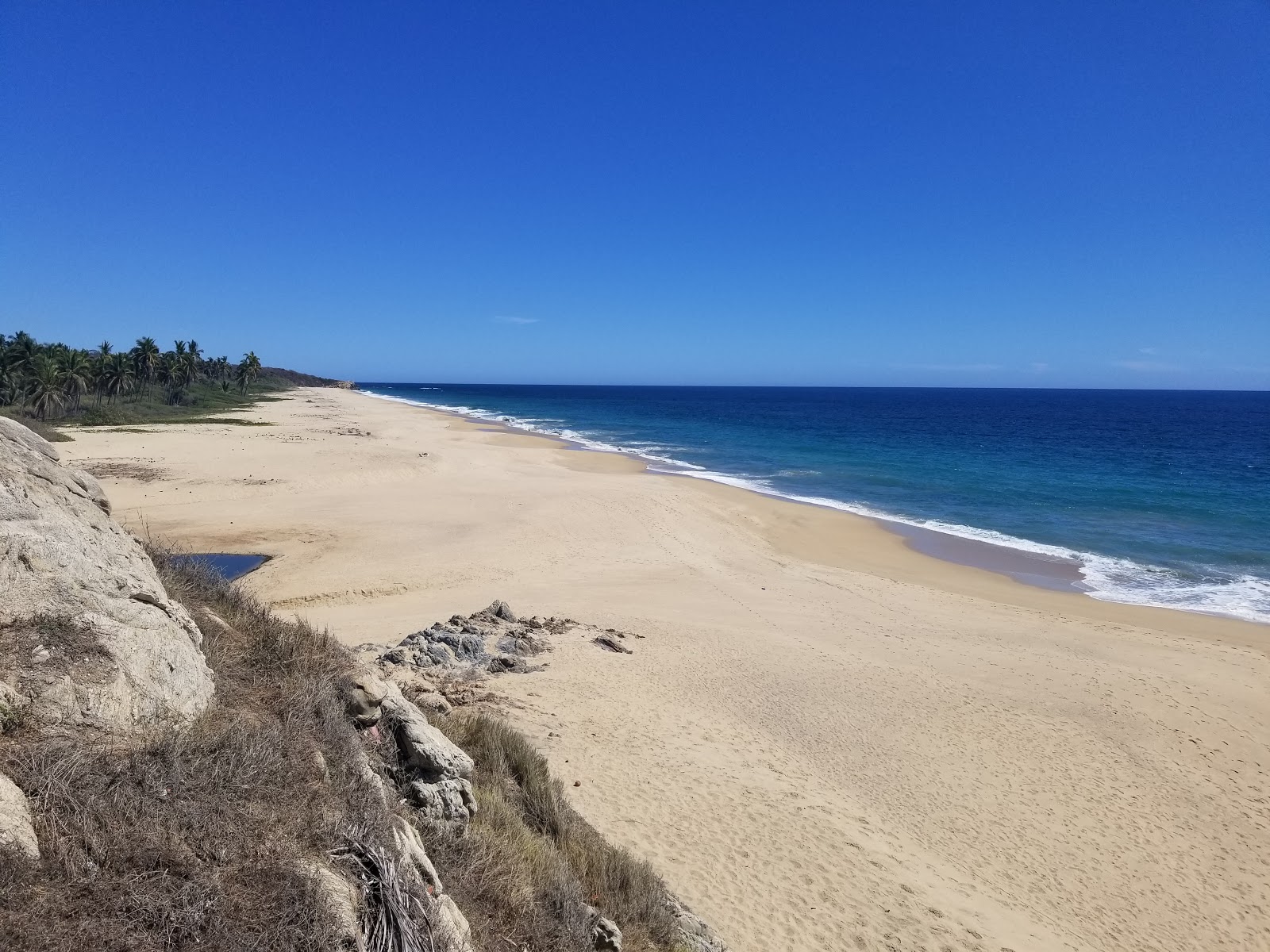 Zdjęcie Zapotengo beach z powierzchnią jasny, drobny piasek