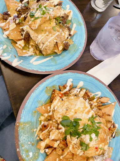 Chilaquiles- green sauce with steak and red sauce with chicken.