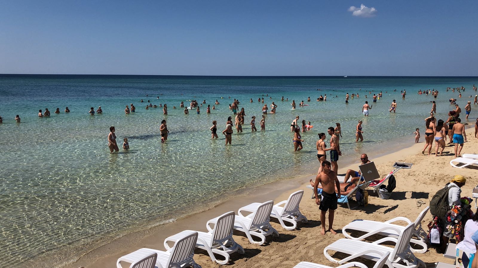 Foto av Spiaggia di Campo dei Messapi med blå rent vatten yta