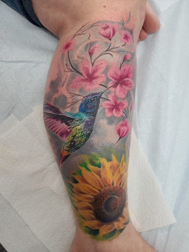 Explore mens behind ear tattoo ideas, creative tattoo ideas in Elko, available at Iron Anchor Tattoo