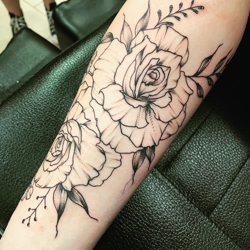 Explore dinosaur tattoo ideas for son, creative tattoo ideas in Satellite Beach, available at Rocksteady Tattoo Company