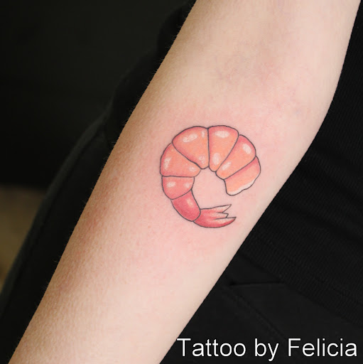 Explore upper arm men tattoo ideas, creative tattoo ideas in Fort Myers, available at Tiger Lotus Tattoo and Piercing