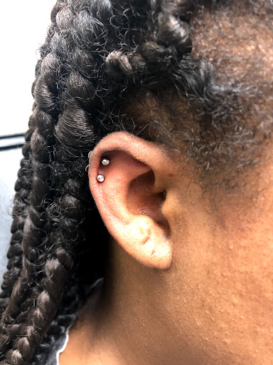 Find under breast tattoo ideas for your next unique tattoo in Houston at Katy Piercing and Tattoo at Venetian