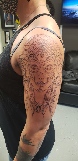 Explore last name back tattoo ideas, creative tattoo ideas in Inman, available at Nine Lives Tattoo