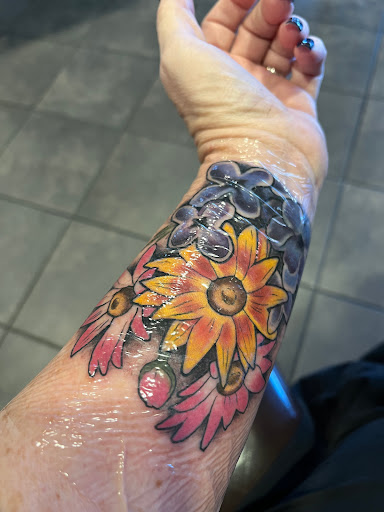 Find tattoo ideas for under the breast for your next unique tattoo in Annapolis at Lucky Bird Tattoo