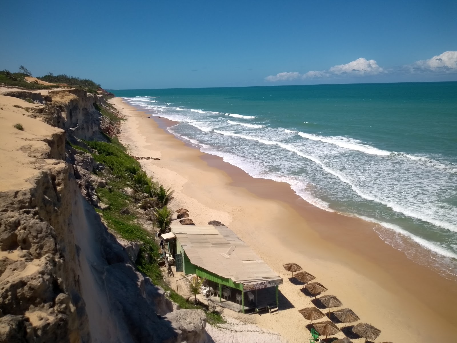 Foto av Enseada do Madeiro med lång rak strand