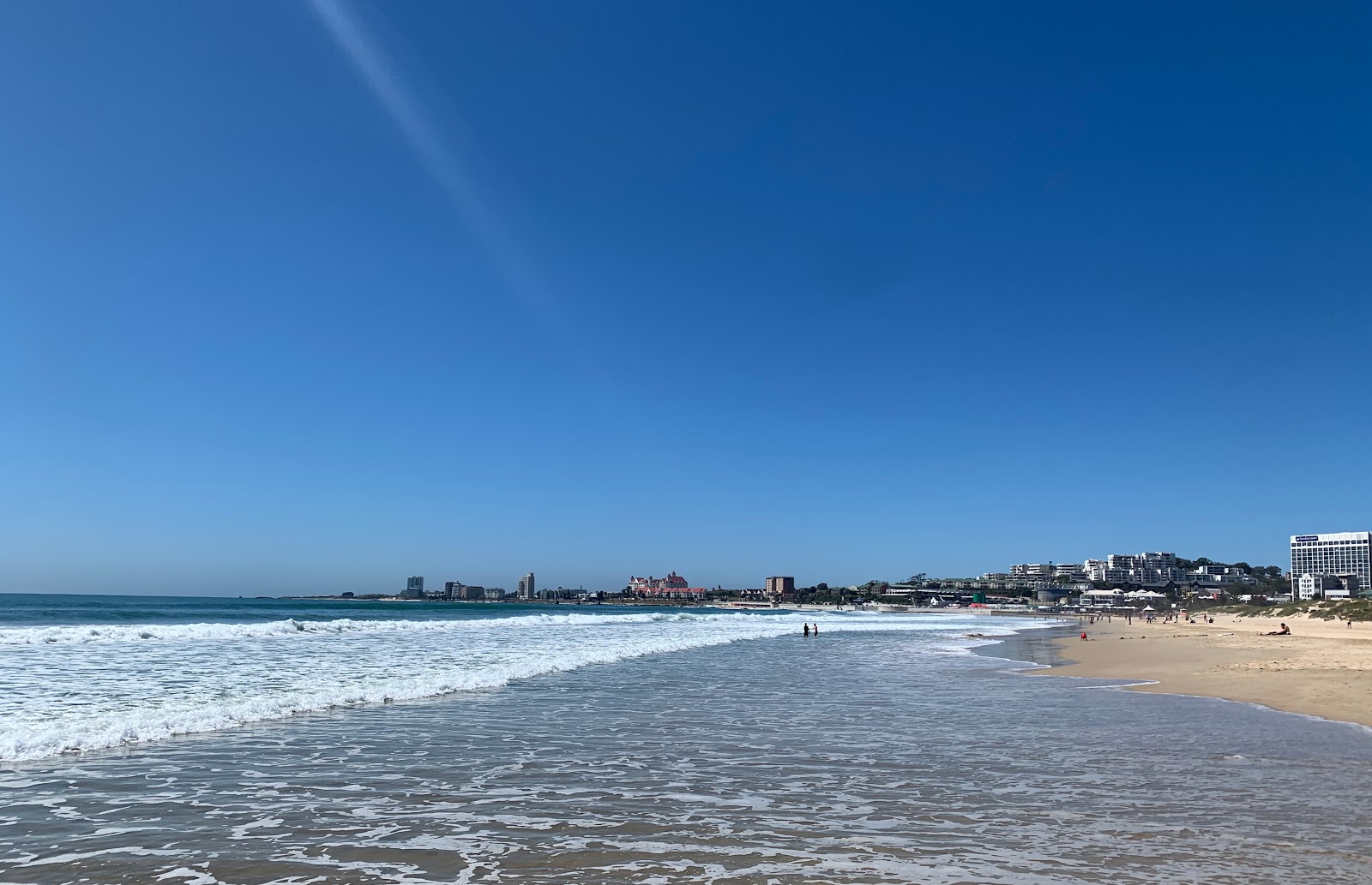 Foto van Kings beach met beige zand oppervlakte