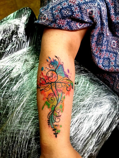 Explore dolphin tattoo ideas, creative tattoo ideas in Conway, available at Primal Urge Tattoos