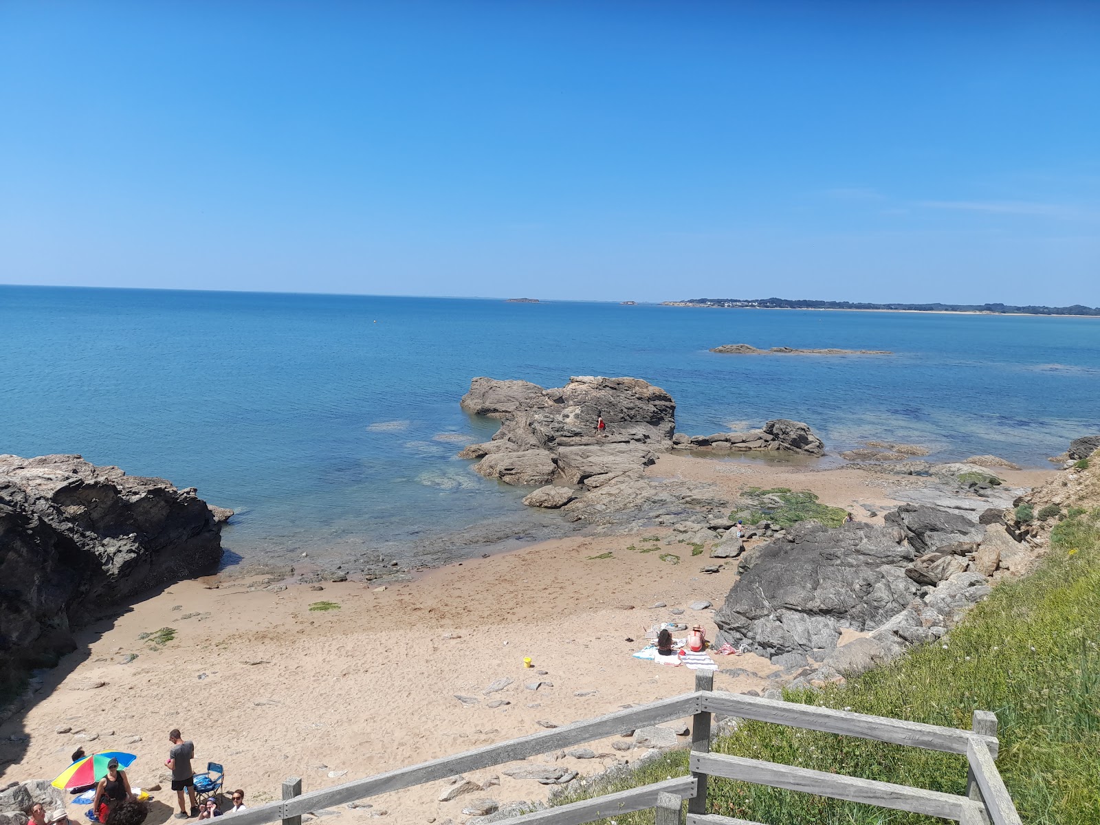 Foto de Plage De Pen Be com areia bege superfície