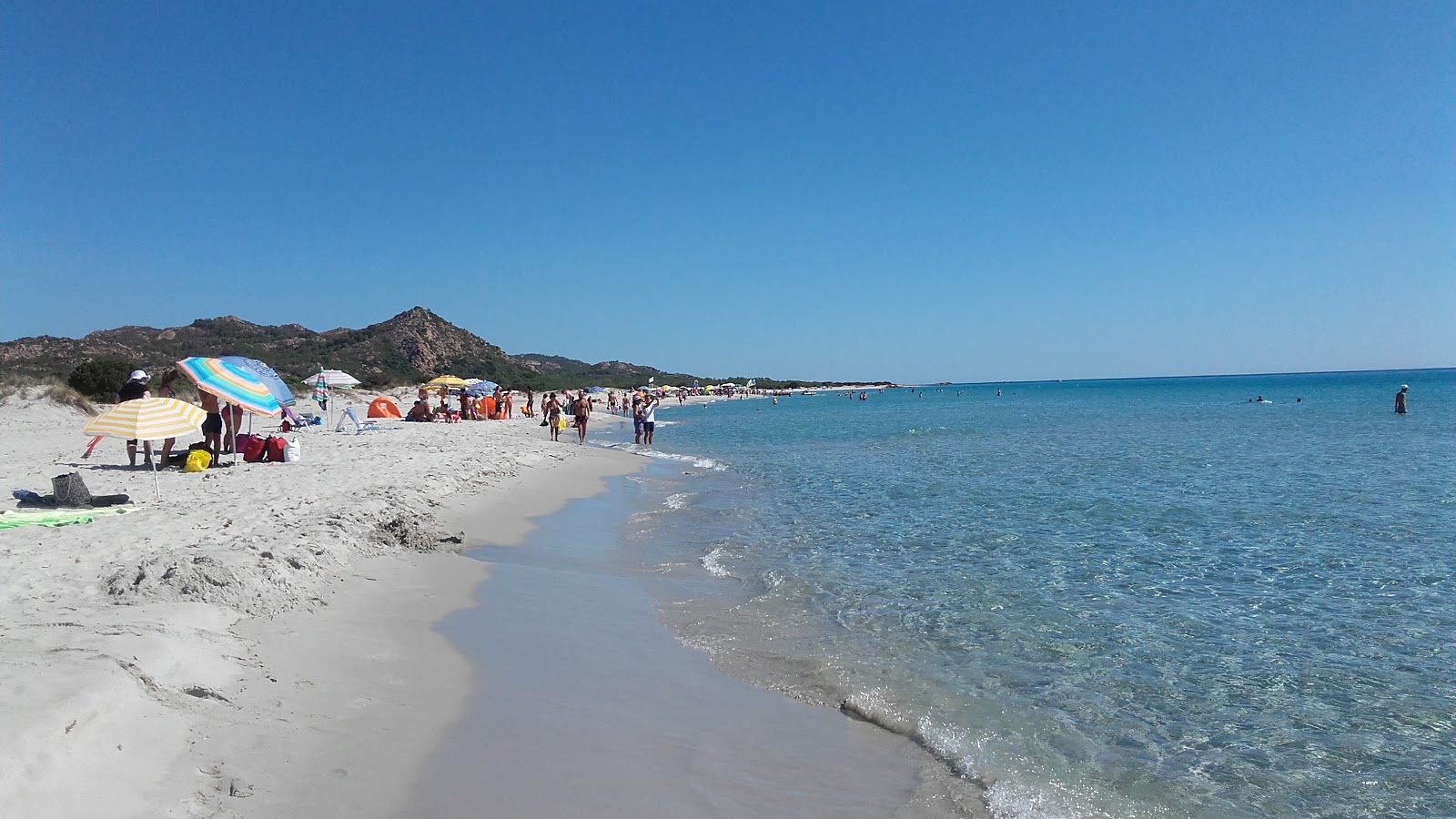 Photo of Berchida Beach with partly clean level of cleanliness