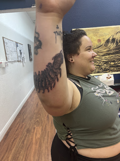 Explore bass guitar tattoo ideas, creative tattoo ideas in Cocoa, available at Rorschach Tattoo Shop and Piercing Studio