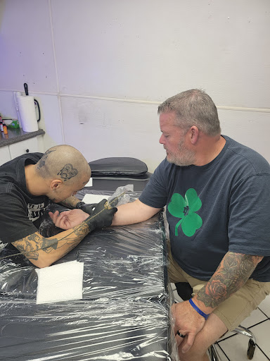 Find boob tattoo idea for your next unique tattoo in Panama City Beach at Oxygen Tattoo and Body Piercing Studio