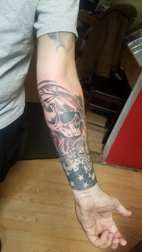 Explore iris flower tattoo ideas, creative tattoo ideas in Elkhart, available at Liquid Ink 2 Tattoos & Body Piercings