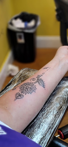 Explore womens sleeve tattoo ideas, creative tattoo ideas in Edison, available at Tattoo Asylum