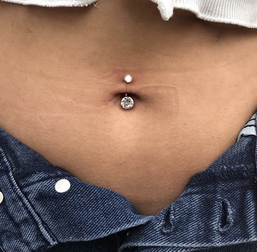 Explore cover up tattoo ideas on hip, creative tattoo ideas in San Diego, available at Luna Studio Body Piercings & Tooth gems