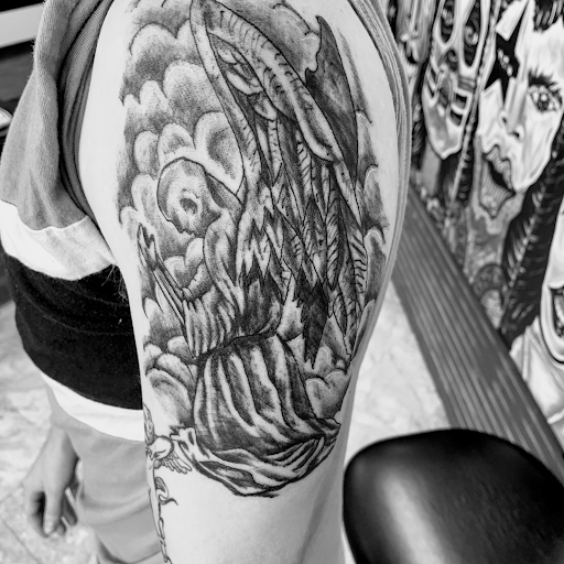 Explore snake tattoo ideas for females, creative tattoo ideas in Seymour, available at American Gypsy Tattoo Corp.