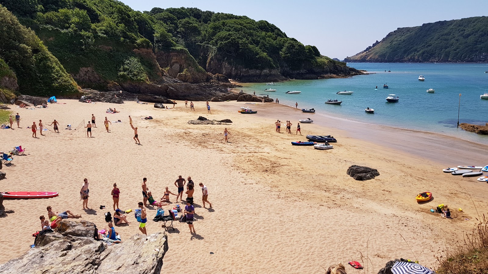 Photo of Sunny cove beach with turquoise pure water surface