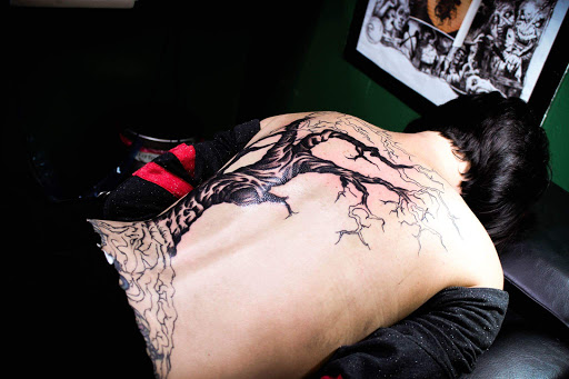 Find between the boob tattoo ideas for your next unique tattoo in Beverly Hills at R-N-R Custom Tattoos