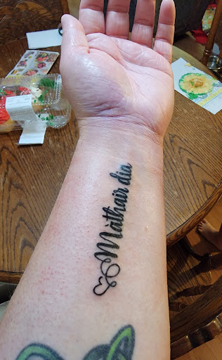 Explore guitar pick tattoo ideas, creative tattoo ideas in Zephyrhills, available at Lions Den Tattoo Company