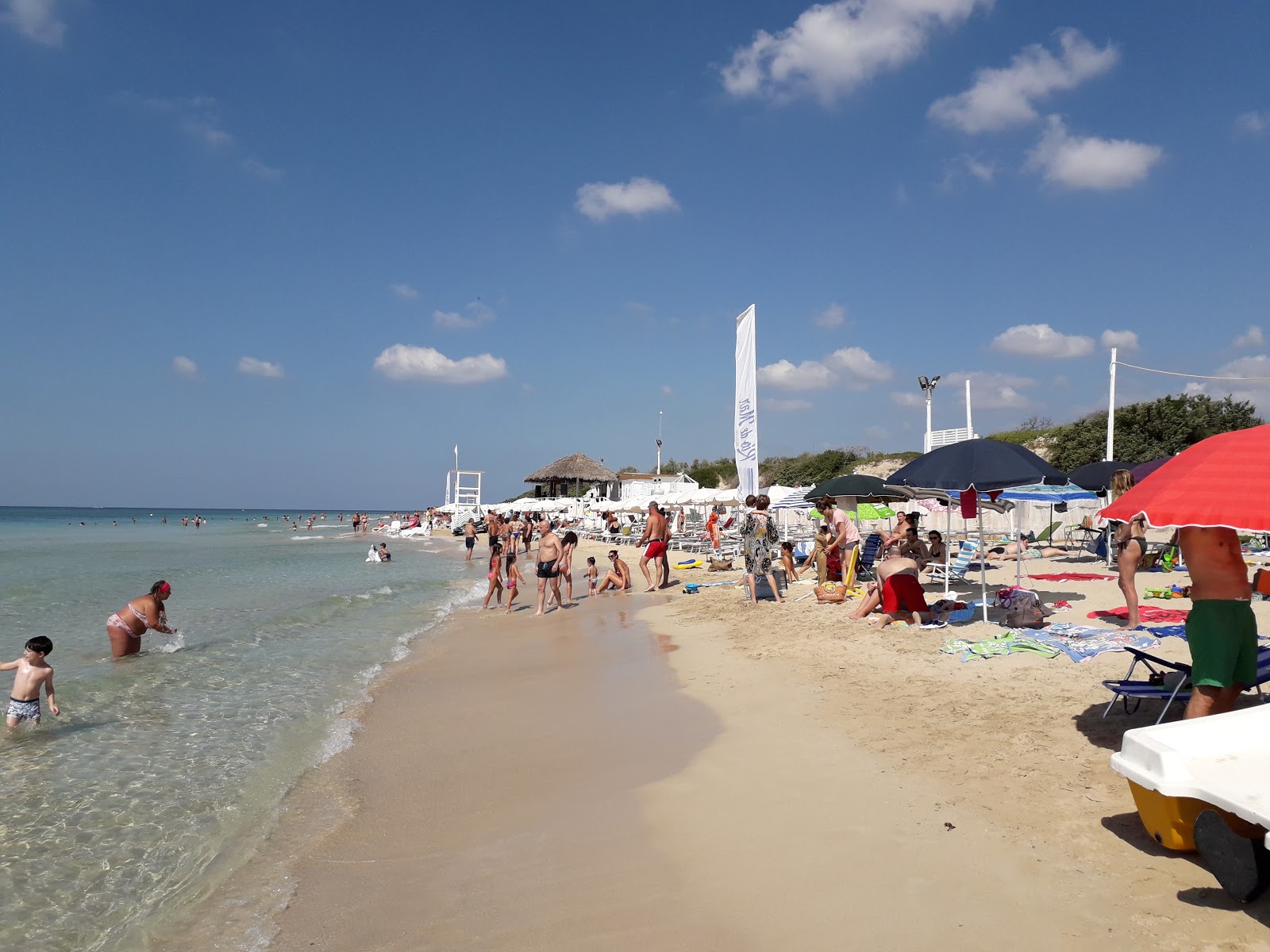 Foto av Spiaggia di Campo dei Messapi med lång rak strand