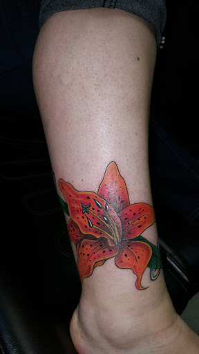 Explore butterfly flower tattoo ideas, creative tattoo ideas in Rome, available at Twizted Ink