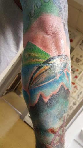 Explore snake tattoo ideas, creative tattoo ideas in Rio Grande, available at Rebel Image Tattooing