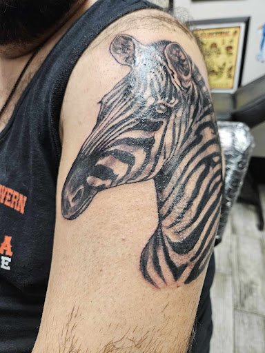 Explore piano tattoo ideas, creative tattoo ideas in Fall River, available at Up In Flames Tattoo