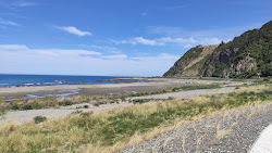 Okiwi Bay Beach'in fotoğrafı geniş ile birlikte