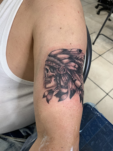 Explore leg tattoo ideas for females, creative tattoo ideas in Bronx, available at Tattoo Kingdom