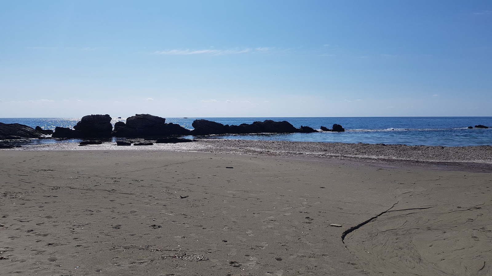 Photo of Ag. Nikolaos beach and its beautiful scenery