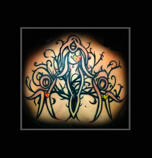 Explore cute female tattoo ideas, creative tattoo ideas in Richmond, available at Art Period llc Tattoos and Artwork by Leigh Odom